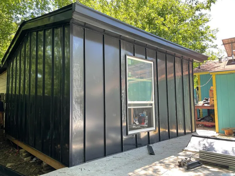 Black standing seam metal wall panels for Roof Inspection in East Aurora